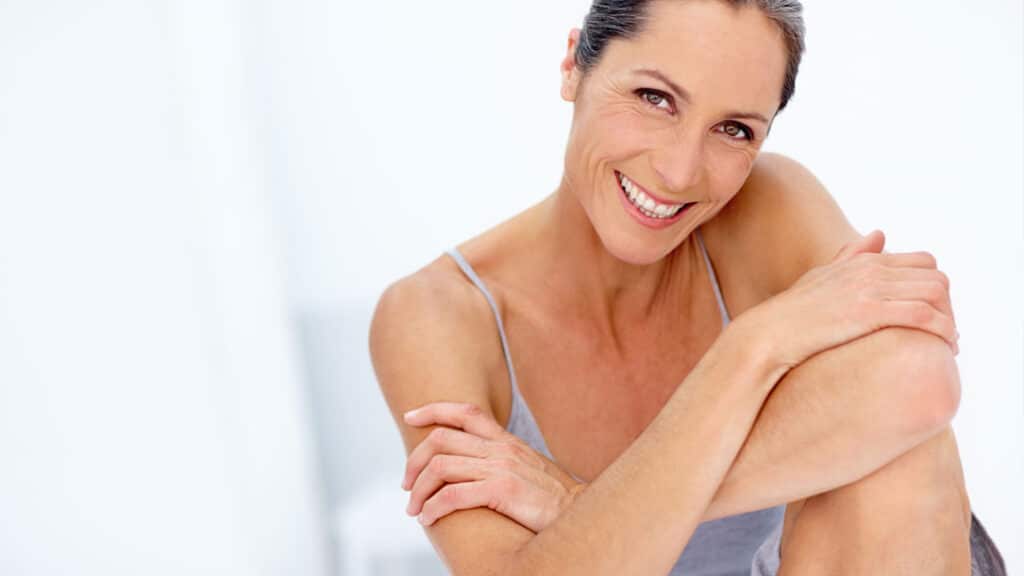 Woman with radiant, healthy skin illustrating the connection between wellness and skin health