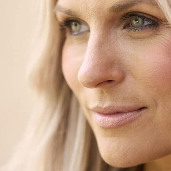 Close-up of a woman with healthy skin illustrating how to restore collagen in the face and improve skin firmness